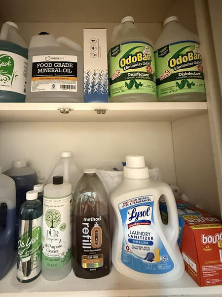 Our supply shelf Shelf of cleaning supplies including Lysol, Method, and disinfectant wipes